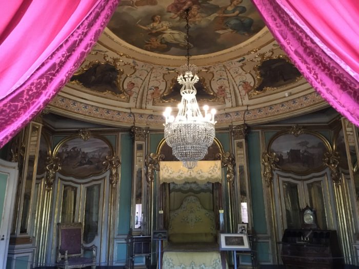 View of an elaborate interior featuring green and white rococo panelling