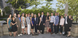 A photograph of Cooper Hewitt's Board of Trustees on the terrace of the Carnegie Mansion.