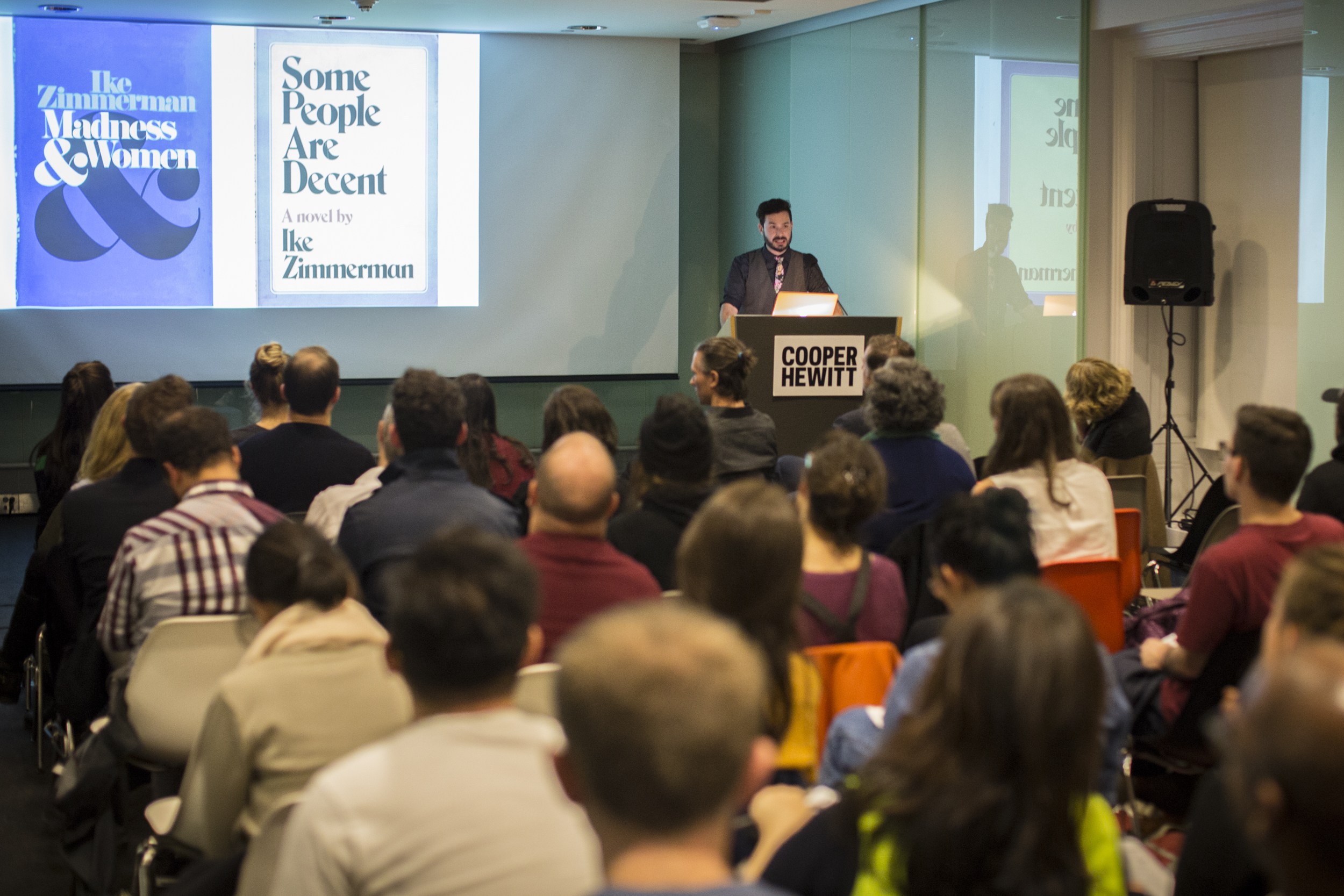 Image of Adam Kesner, Minister of Information at Trivial Dispute leads a group in a trivia game at Cooper Hewitt