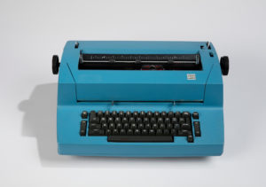 CORRECTING SELECTRIC II, MODEL 895 TYPEWRITER AND TYPING ELEMENTS; 1973; Designed by Eliot Noyes (American, 19101977); Manufactured by IBM (Armonk, New York, USA); Aluminum, steel, molded plastic; typewriter: 18 × 51 × 38 cm (7 1/16 × 20 1/16 × 14 15/16 in.); typing element (each): Diam. 3.8 cm (1 1/2 in.); Gift of Robert M. Greenberg, 2017-51-10-a/g