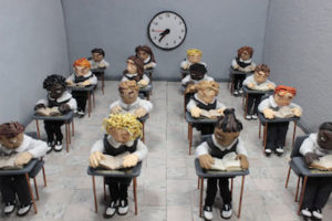 a claymation still of a classroom of students from a film short that will be screened at Cooper Hewitt on March 9. Scroll down for more information.