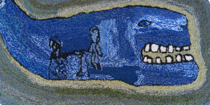 Detail of rug by Creative Growth artist Sallie Williams, featuring a blue whale.