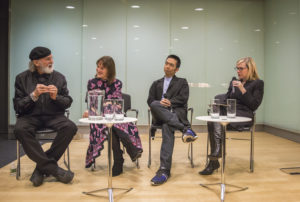 Image of a panel discussion at Cooper Hewitt. From the left: Bob Greenberg in black, Jackie Goldberg in a pink flower dress, John Maeda in a gray suit, and Debbie Millman in black.
