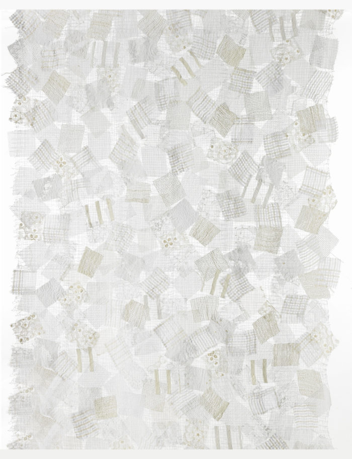 Length of fabric in which squares of various woven and embroidered white Nuno fabrics are machine stitched to a water-soluble base cloth which is then dissolved away, leaving an open ground with 'floating' scraps. Please scroll down to read the blog post about this object