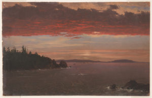 A low wooded promontory protrudes toward the right in the left middle distance. Boulders are shown in the right foreground. Hilly coast in rear. A dark reddened cloud bank stretches across the sky, the ocean below.
