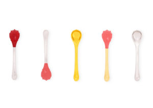 Five spoons with red bumpy bowls and brightly colored handles. AEIOU I Rear Bump series, from the Sensory Dessert Spoon collection, 2015–18; Jinhyun Jeon (South Korean, born 1981), Studio Jinhyun Jeon; Stainless steel, lacquered and/or 24-carat gold plated; Courtesy of Jinhyun Jeon. On view in the exhibition The Senses: Design Beyond Vision.