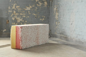 A bench made of yellow and pink foam and coated with small white pieces. Bench, Yellow-Rosa Pie Cut with Crumbs, from the Importance of the Obvious collection, 2013; Matthias Borowski (German, born 1983), Kollectiv Plus Zwei (Vienna, Austria, founded 2014) On view in The Senses: Design Beyond Vision.