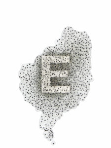 The letter "E" formed from frog eggs. Frogspawn Typography, from the Visceral Typography collection, 2014; Monique Goossens. On view in The Senses: Design Beyond Vision.