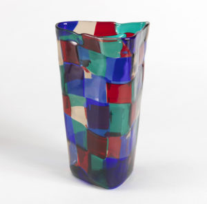 Image features upright triangular vase composed of blue, red, green and clear glass squares. Please scroll down to read the blog post about this object