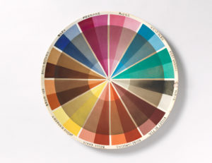 An image of a 1920s glazed earthenware sample plate depicting a color wheel. Scroll down for information about the exhibition Saturated: The Allure and Science of Color now on view.