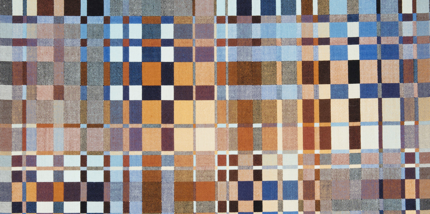 A detail of a woven textile designed by Richard Landis featuring a complex geometric design of interlocking squares and rectangles in blue, brown, grey, and beige, and light blue. Scroll down to learn more about our upcoming exhibitions.