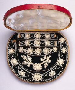 Image features suit of necklace, brooch, earrings, bracelets and bodice ornament with sead pearl decoration in floral forms. Please scroll down to read th blog post about this object.