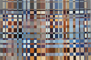 Rectangular weaving with a grid-like pattern of small squares and rectangles in shades of black, white, gray, blue, rust, and ochre. Click on the image to learn more about an exhibition of Richard Landis textiles.