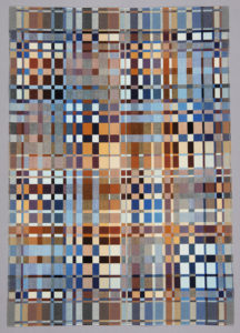 Rectangular weaving with a grid-like pattern of small squares and rectangles in shades of black, white, gray, blue, rust, and ochre.