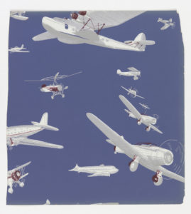 Image features wallpaper with a variety of white aircraft against a blue background. Please scroll down to read the blog post about this object.