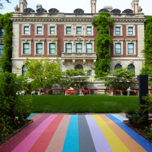 An image of the Manhattan Color Walk, a design installation in the museum's garden of a striped walkway made up of a collection of colors found throughout Manhattan. Scroll down to find out more about the installation and its designer.