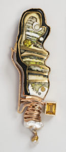 Image features brooch of long organic shape, the irregular edges bordered in gold, surrounding abstract decoration of gold strips enclosing cloisonné enamel in tones of white, yellow-green, gold and black; baroque pearl and faceted square citrine at bottom. Please scroll down to read the blog post about this object.