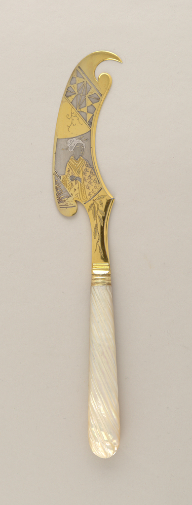 Image features fruit knife with shaped silver and silver-gilt blade decorated with image of a Japanese woman in a kimono flanked by foliage designs; white, ridged mother-of-pearl handle. Please scroll down to read the blog post about this object.