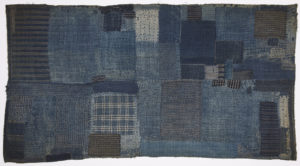 Image features: Child's sleeping mat composed of several layers of indigo dyed cotton fabrics, patched and heavily stitched. Please scroll down to read the blog post about this object.