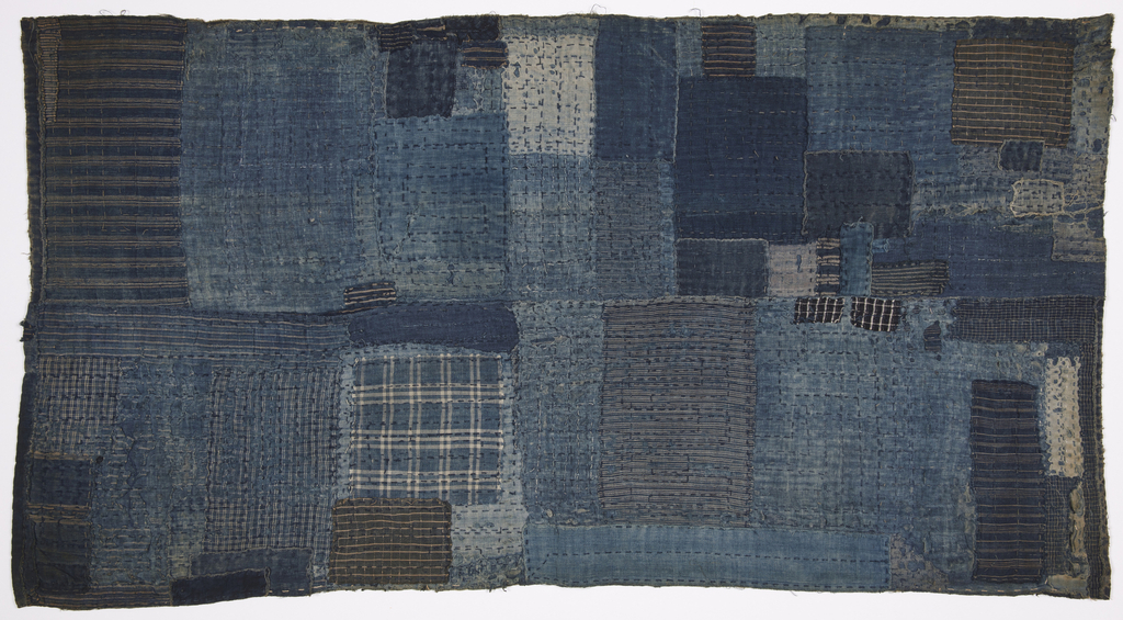 Image features: Child's sleeping mat composed of several layers of indigo dyed cotton fabrics, patched and heavily stitched. Please scroll down to read the blog post about this object.