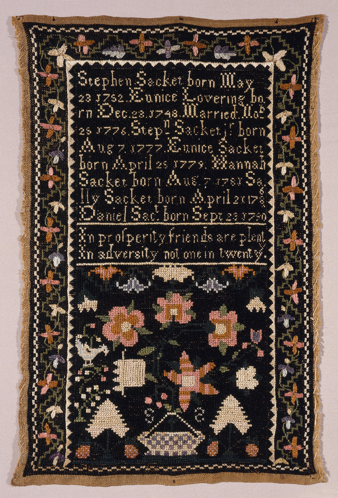 Image features a rectangular sampler, in the upper half, a record of the births of members of the Sacket family: Stephen Sacket born May 23 1752. Eunice Lovering born Dec. 23 1748. Married Nov. 25 1776. Steph'n Sacket Jr. born Aug 7 1777. Eunice Sacket born April 25 1779. Hannah Sacket born Aug 7 1781. Sally Sacket born April 21 1786. Daniel Sact. born Sept 23 1790. Followed by a verse: "In prosperity friends are plenty In adversity not one in twenty." With scattered floral motifs and the initials SS in the lower half, and a floral border on three sides. The black background is embroidered on natural colored cloth. Please scroll down to read the blog post about this object.
