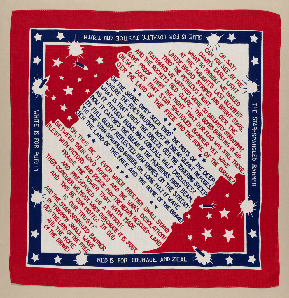 Square rayon handkerchief printed in red and blue on white showing the lyrics of the Star-Spangled Banner surrounded by stars and fireworks. Printed along border: Blue is for Loyalty, Justice and Truth/ White is for Purity / Red is for Courage and Zeal. Please scroll down to read the blog post about this object.