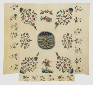 Overhangs made of what were originally three valances belonging to the complete set. Embroidered with flowering trees, birds, and, in the center, a medallion showing a landscape with a large flowering tree surrounded by deer.