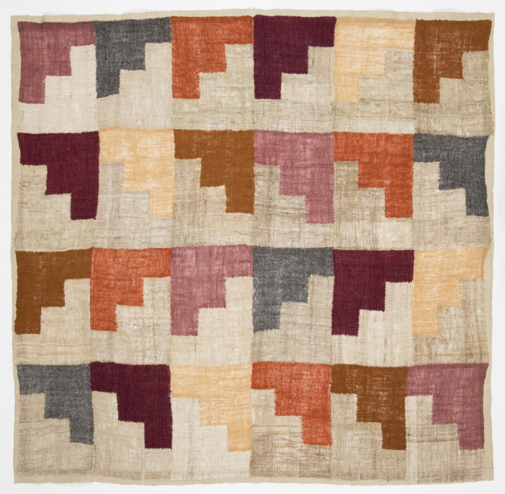 Image features a square weaving with a grid of stepped motifs in soft shades of browns, tans, pinks, and blues. Scroll down to read the blog about this object.