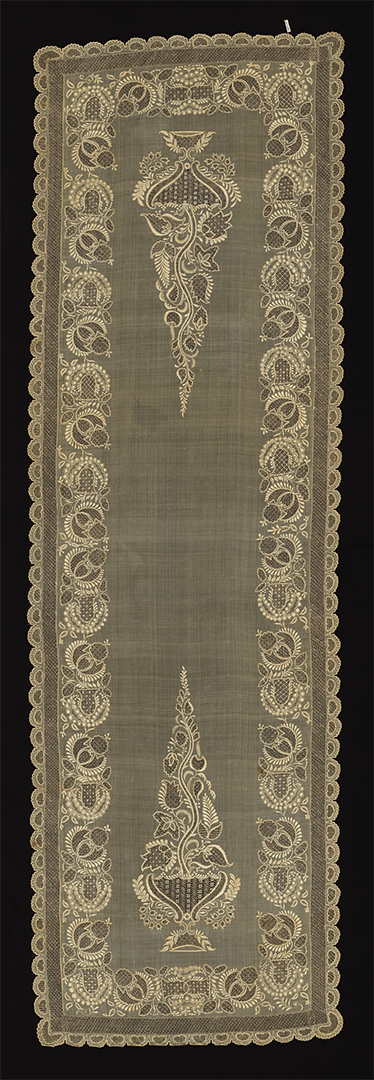 Image features a sheer ivory scarf embroidered with a flowering tree in a bowl at each end. Scroll down to read the blog about this object.