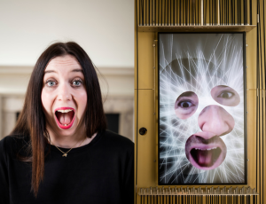 A visitor interacts with Zachary Lieberman's Expression Mirror in Cooper Hewitt's "Face Values" installation at the 2018 London Design Biennale. Photo David Levene.