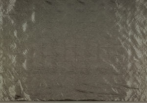 Image features: Yardage of full manufactured width, silver-colored, metallic coated plain woven polyester with wavy linear pattern from the embossing. Please scroll down to read the blog post about this object.