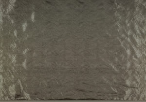 Image features: Yardage of full manufactured width, silver-colored, metallic coated plain woven polyester with wavy linear pattern from the embossing. Please scroll down to read the blog post about this object.