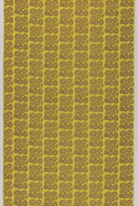 Image features: Dark yellow fabric with vertical columns of rounded geometric shapes in neat clusters, each with a zigzag border and filled with a smiling face. Each face is filled with red and orange polka dots. Please scroll down to read the blog post about this object.