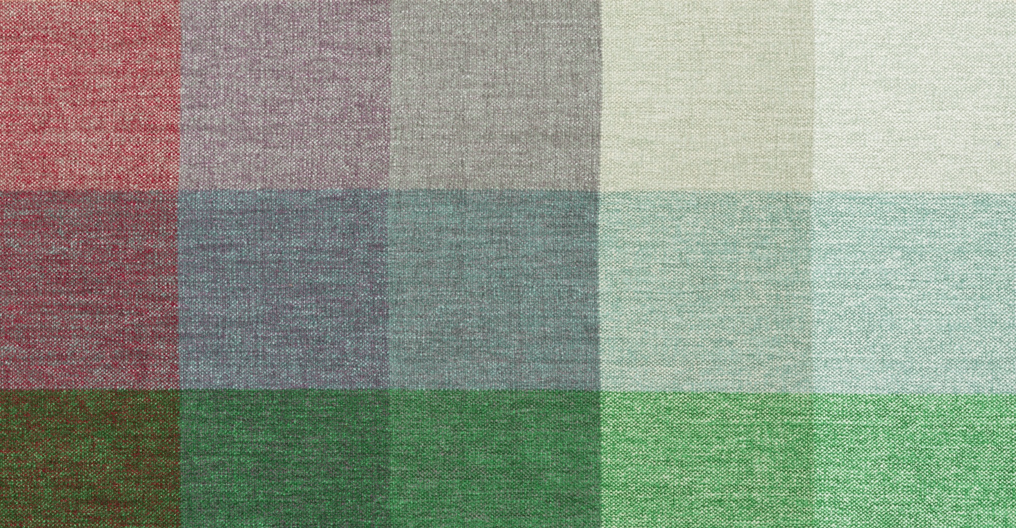 Woven textile with a grid of squares of subtly graduated colors.