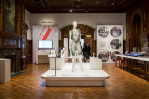 Image of gallery shot of Access+Ability exhibition featuring a large mannequin in the center of a room.