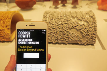 Image of an iphone displaying the senses accessible exhibition guide application.