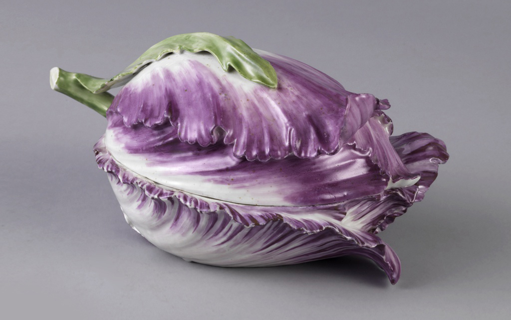 Tulip laid horizontally, with upper and lower portions of dish composed of full length petals.