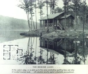 A black-and-white advertisement. The image is dominated by a photograph of a wooden cabin positioned close the the water of a lake. It is surrounded by trees, with a large hill covers in trees in the background across the lake. Superimposed on the lower left of the photograph is what appears to be the floorplan of the pictured cabin. Beneath the photograph is text that reads ". . . The Erskine Lakes . . . / At the water's edge, or on plots up to five acres overlooking sparkling lakes and miles of wooded mountain lands . . . with absolute security against undesirable encroachment."