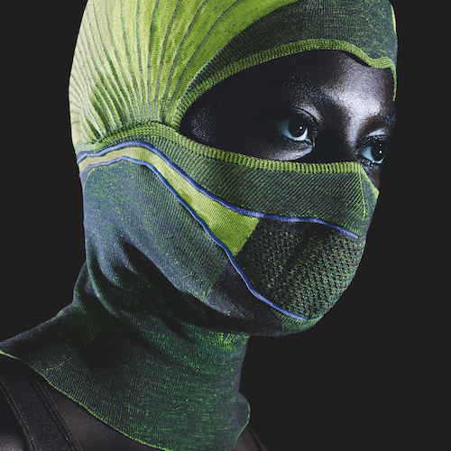 Person wearing a sporty, technical green balaclava