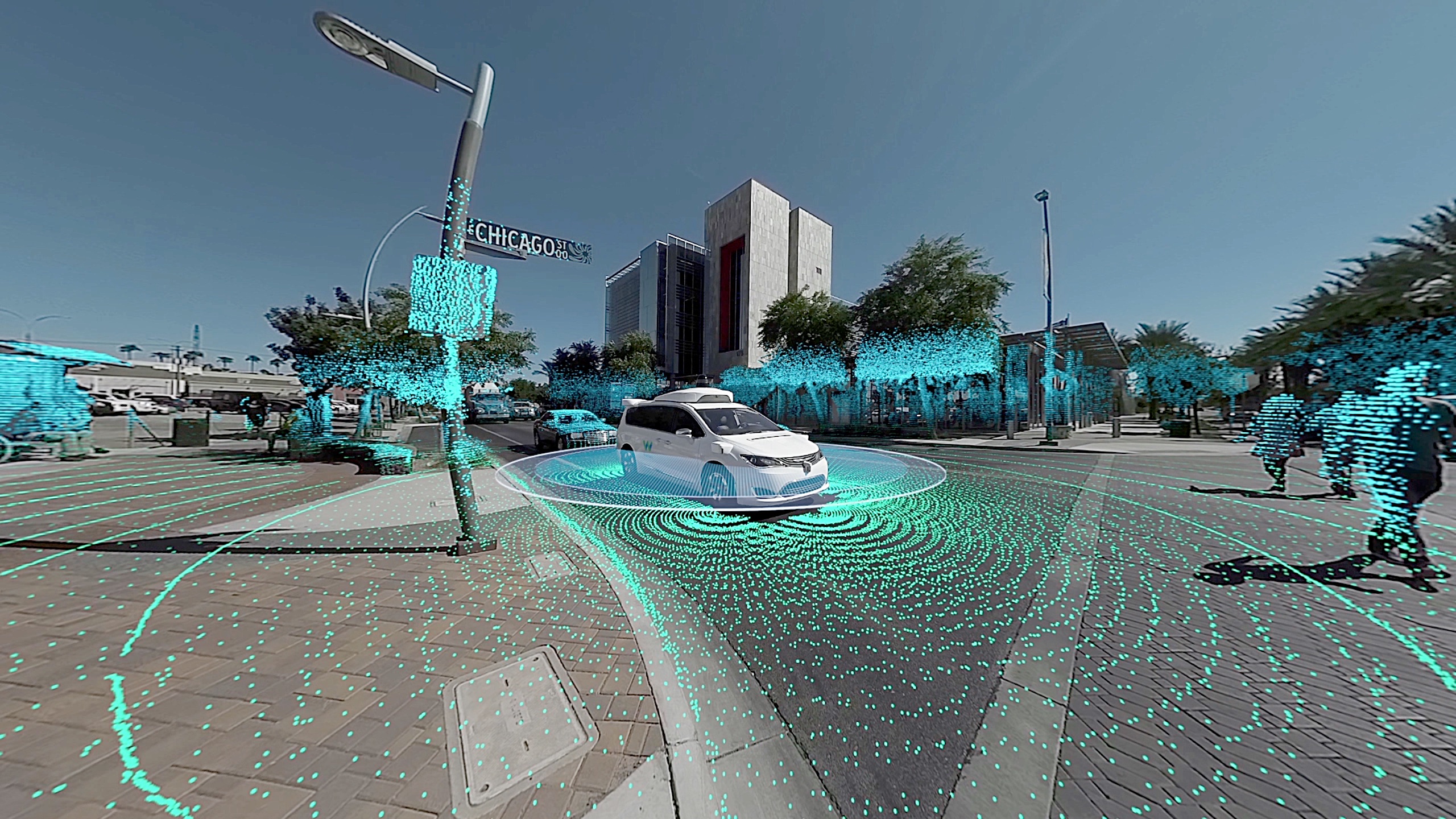 A photo illustration shows a Chicago street against a blue sky. Cars move toward along the city street and little blue dots emanate out in circles from a white car. The dots also cover the street sign and surrounding trees. They are meant to represent the data being collected and used by autonomous vehicles. Scroll down for information on our February 25 program "Designing the Connected City."