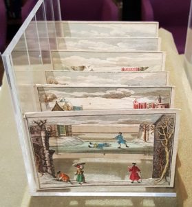 Image features Winter Scene plates set up in modern display box.