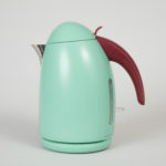 A squat, bullet-shaped robin's egg blue electric kettle with a burgundy handle.