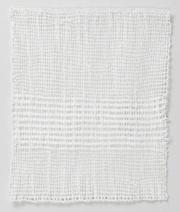 Image features: A white four-sided selvage textile loosely woven with striped pattern on the bottom half. Please scroll down to read the blog post about this object