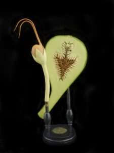 Anatomical model of Ficus carica glued to a vertical rod mounted on a stepped base with affixed paper label