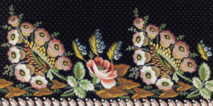 Brightly colored floral embroidery on black fabric. Scroll down for more program information.