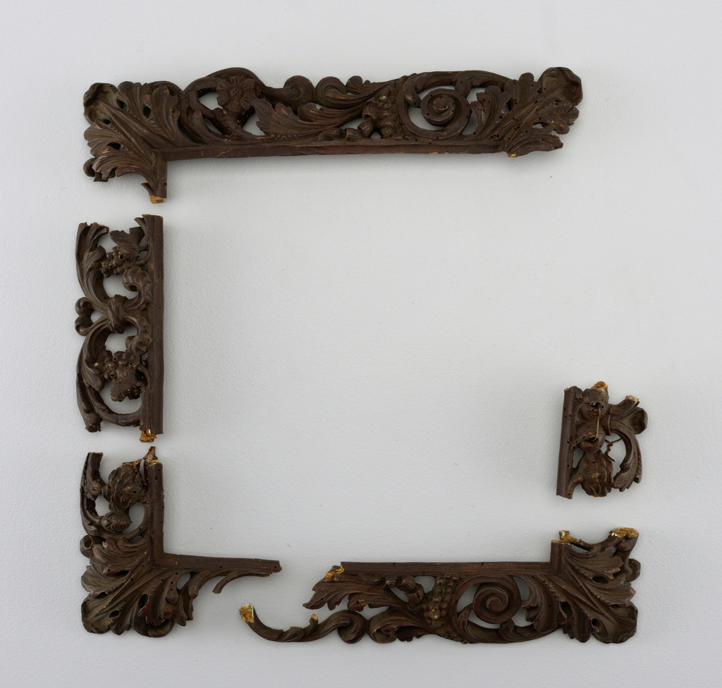 Fragments of an ornately carved picture frame