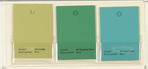 Three color swatches of yellow-green, green and blue-green