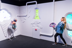 Two adults at play in an interactive installation