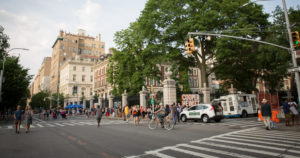 On a beautiful summer evening, at the intersection of 90th Street and 5th Avenue, Museum Mile goers walk up and down 5th Avenue, probably headed to Cooper Hewitt, housed in a beautiful mansion. There's even an ice cream truck parked out front for anyone who wants an icy treat!