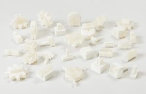 Image features white 3D-printed construction toy kit connectors of various shapes and sizes. Please scroll down to read the blog post about this object.